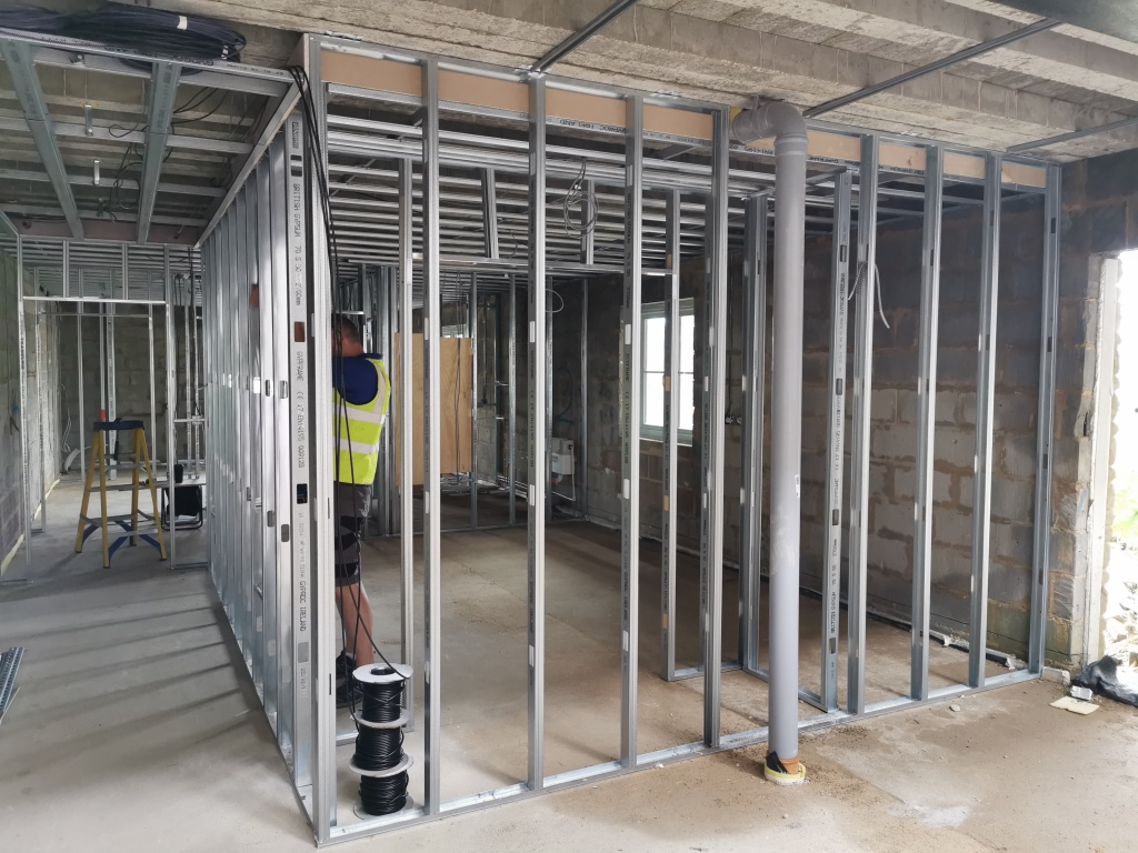 Image showing metal frame partitions being installed